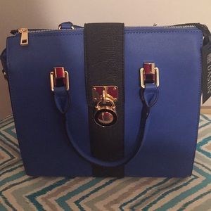 Blue and black purse with lock satchel